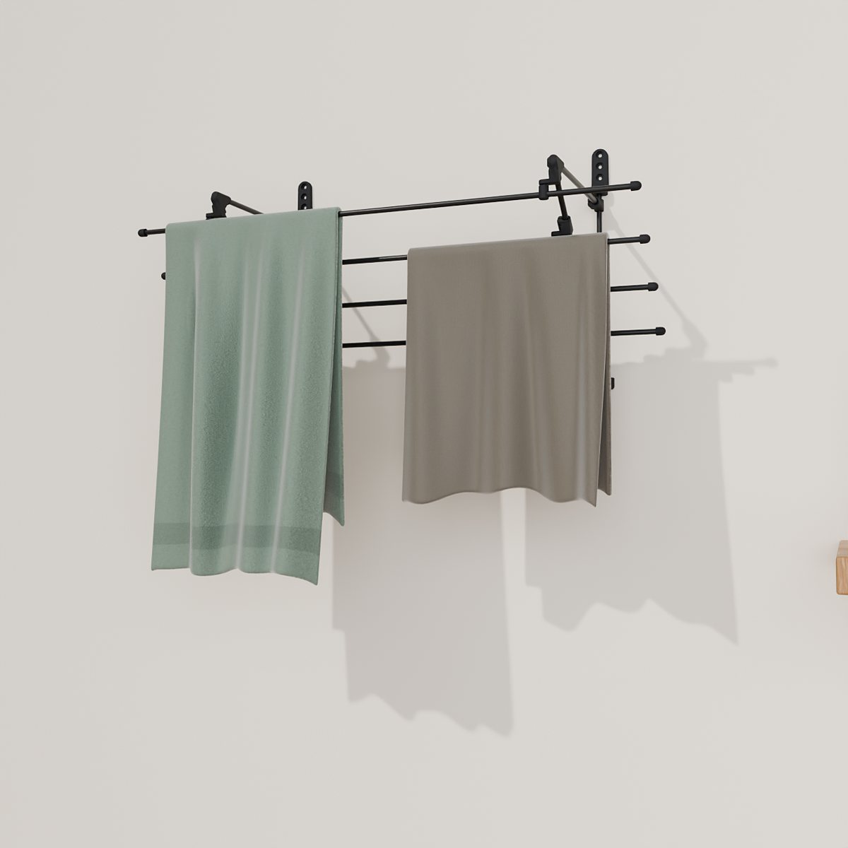Black Airstair rack with a towel and sweater