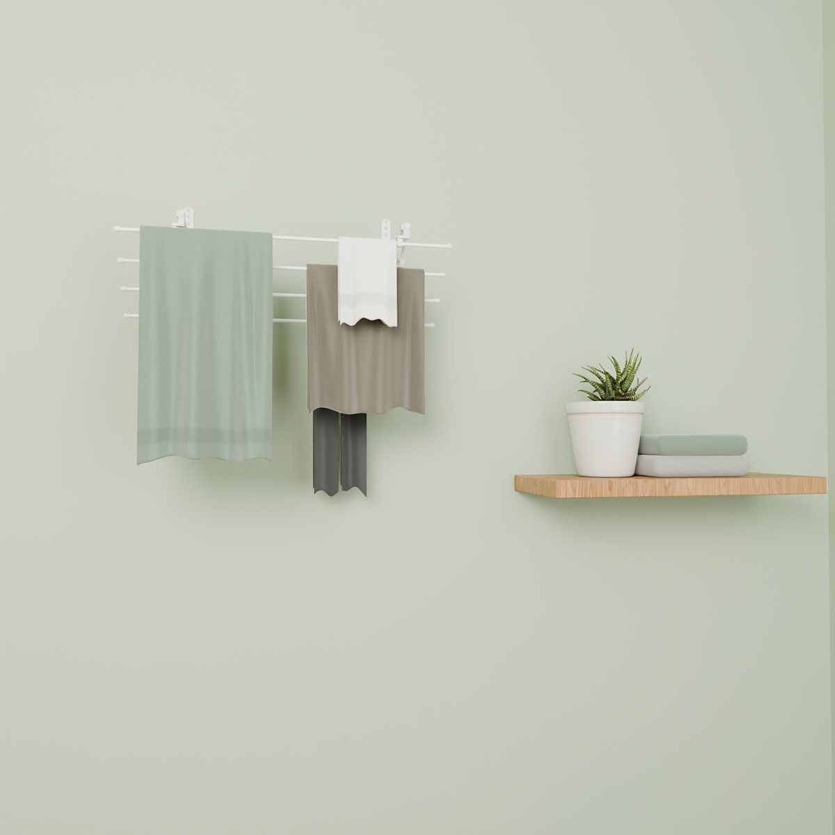 White Airstair on a sage green wall with towels drying